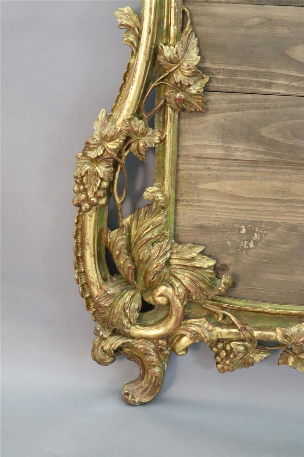 A 19th century giltwood overmantel mirror frame, width 4ft 1in. height 7ft 8in.